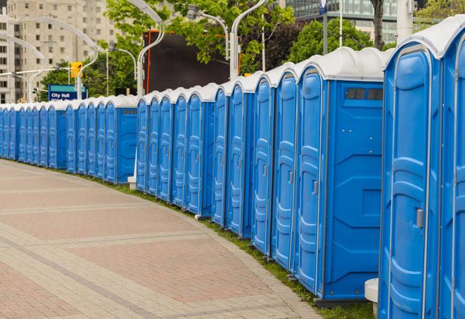 a row of portable restrooms at an outdoor special event, ready for use in Cameron Park, CA